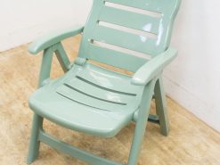 Mint green slatted chair for stylish, comfortable indoor and outdoor seating.