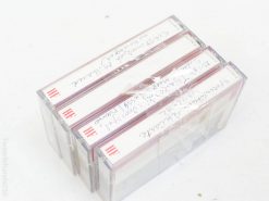 Vintage cassette tapes with handwritten labels, capturing personal audio memories and nostalgic charm.