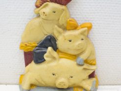 Whimsical pig trio figurine, perfect for cozy, playful home decor and charming accents.