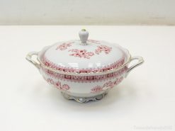 Elegant porcelain tureen with red floral design and gold trim for stylish dining experiences.