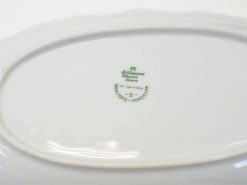 Elegant West German porcelain dish with quality seal and refined oval shape.