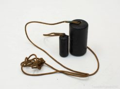 Cylindrical weights with string for balance and coordination training in fitness routines.