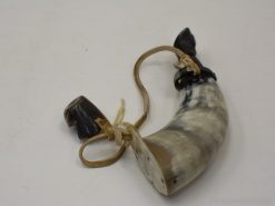 Antique animal horn powder horn with leather straps, showcasing exquisite craftsmanship and historical significance.