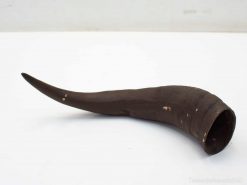 Elegant dark wood horn, handcrafted, versatile for decor or collection, steeped in cultural significance.