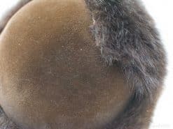 Luxurious brown velvet hat with fluffy fur trim, ideal for fashionable winter wear.