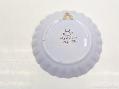 Elegant Makkum plate with scalloped edge, crown motif, and vintage inscription, ideal for collectors.