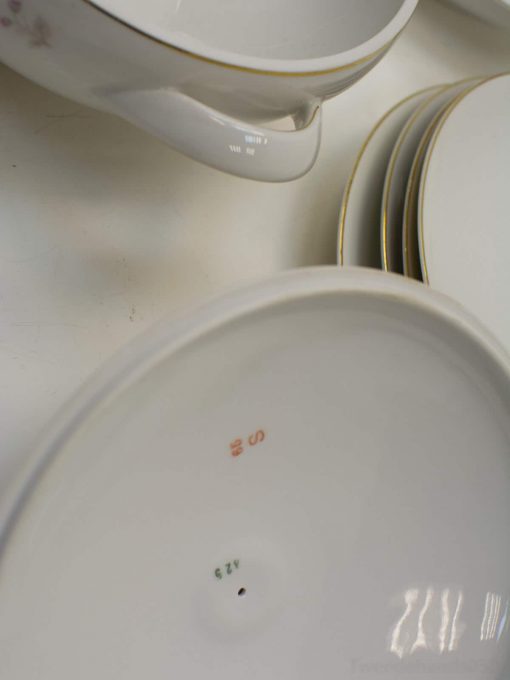 Elegant porcelain dinnerware with gold trim for upscale dining and special occasions.