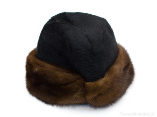 Elegant black and chocolate brown fur hat for stylish warmth in winter.