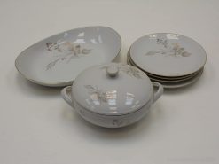 Elegant vintage porcelain dishware set with floral designs, ideal for chic dining experiences.