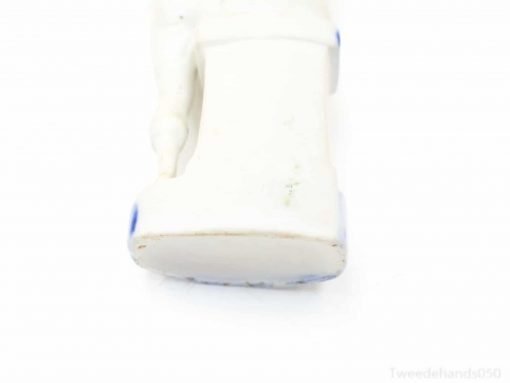 Elegant white porcelain figurine with subtle blue details, ideal for decor and collectors.