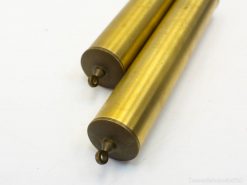 Polished brass cylinders showcasing vintage elegance, ideal for collectors and decor enthusiasts.