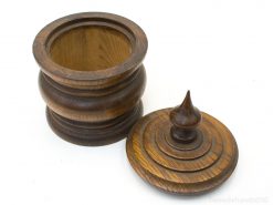 Elegant wooden storage container with decorative lid, ideal for stylish home organization.