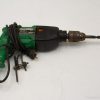 Ergonomic black and green Hitachi drill, designed for durability and precision in DIY projects.