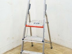 Lightweight three-step aluminum ladder with safety features, perfect for home improvement tasks.