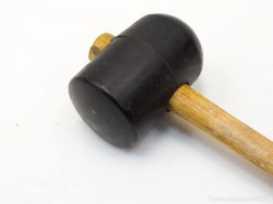 Durable rubber mallet with wooden handle, ideal for woodworking and delicate precision tasks.