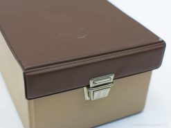 Chic beige storage box with a glossy brown lid and silver latch for elegant organization.