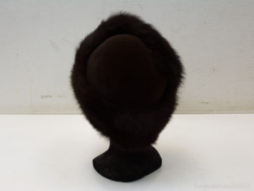 Elegant vintage fur hat, adding style and warmth to winter ensembles. Perfect for special occasions.