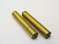 Polished brass cylinders with character, perfect for decor or functional uses in any setting.