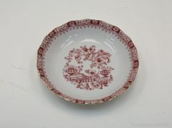 Elegant vintage porcelain dish with floral transferware design, perfect for display or dining.