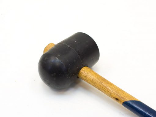 Vintage rubber mallet with wooden handle, ideal for precise woodworking and DIY tasks.