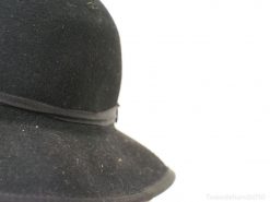 Timeless vintage black felt hat with luxurious ribbon, ideal for any stylish occasion.