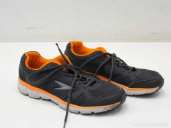 Black athletic shoes with vibrant orange accents, ideal for comfort and stylish performance.