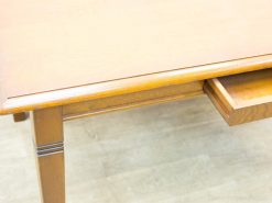 Elegant vintage wooden table with a drawer, perfect for modern and minimalist interiors.