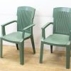 Stylish green plastic chairs for comfortable indoor and outdoor seating.