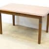 Elegant vintage wooden table with drawer, perfect for dining and workspace versatility.