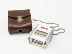 Vintage measuring device and leather case, showcasing classic design and exquisite craftsmanship.