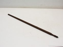 Antique wooden staff with carved handle, perfect for decoration or ceremonial displays.