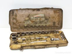 Vintage socket wrench set in a worn metal case, showcasing durability and craftsmanship.