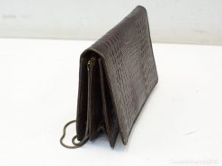 Stylish brown crocodile-print clutch with organized compartments for cash and cards.