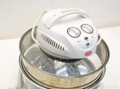 Compact halogen oven with glass bowl for versatile, healthy cooking and easy temperature adjustments.