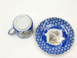 Elegant blue and white porcelain set featuring intricate floral motifs and traditional scenes.