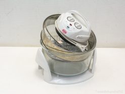 Sleek halogen oven with glass bowl for healthy cooking and efficient meal preparation.