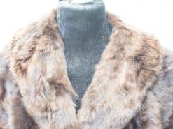 Luxurious vintage fur coat in brown hues with a plush collar for sophisticated winter fashion.