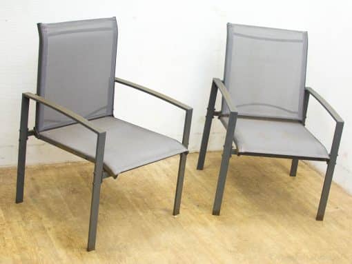 Stylish gray outdoor chairs with metal frames and breathable mesh for comfortable relaxation.