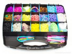 Organized box with colorful rubber bands and tools for creative crafting and jewelry making.