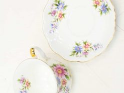 Elegant floral tea cup and saucer with gold trim, ideal for sophisticated tea occasions.