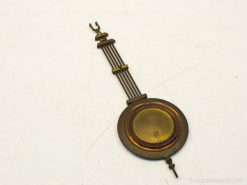 Vintage antique hanging piece with amber glass lens and elegant metal rods for collectors.