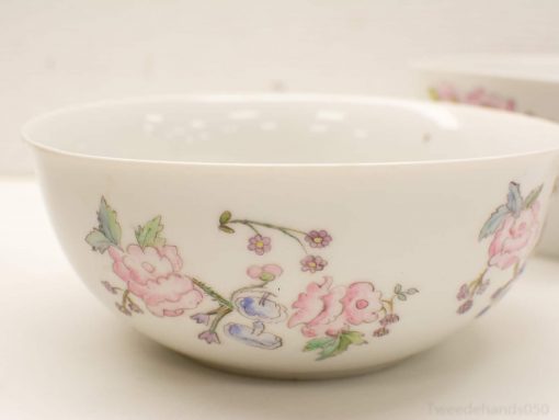 Elegant porcelain floral bowl with pastel motifs, ideal for display or serving.