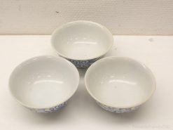 Charming set of three blue-patterned porcelain bowls, ideal for serving or decoration.