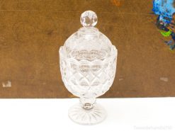 Elegant crystal compote with lid, showcasing exquisite craftsmanship for decorative and functional use.