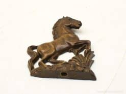 Elegant bronze horse sculpture with floral accents, perfect for art lovers and collectors.