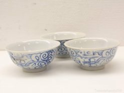 Delicate white porcelain bowls with exquisite blue patterns for elegant dining and decor.