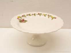 Timeless porcelain cake stand with pink roses, ideal for elegant dessert displays and celebrations.