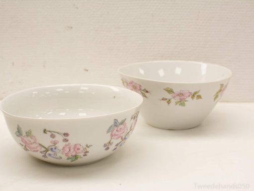 Elegant vintage porcelain bowls with floral patterns, perfect for stylish dining and decor.