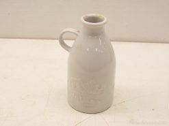 Charming white ceramic jug, ideal for decor or everyday use in any setting.