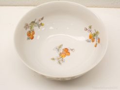 Elegant white porcelain bowl with vibrant hand-painted fruit designs for serving or decoration.